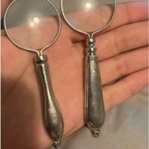 Or best offer. Two Small handheld glass magnifiers